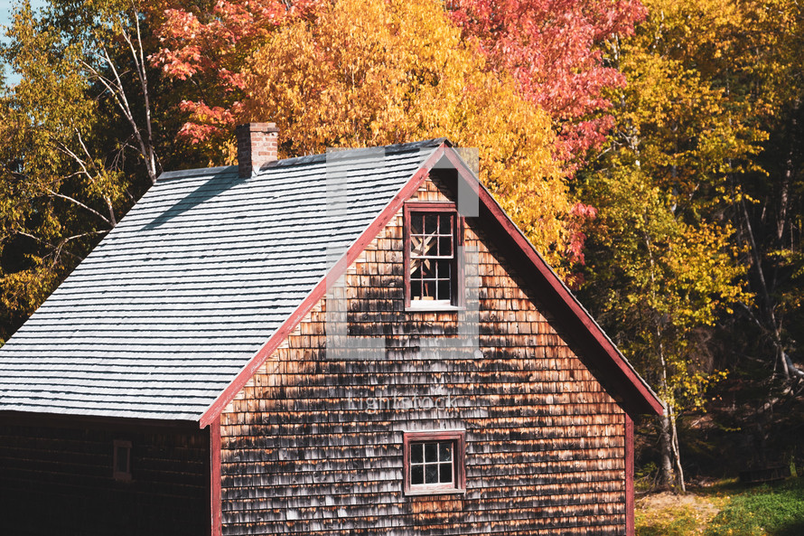 house with wooden shingles in fall 