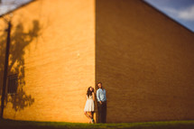 Couple standing in front of building 