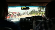 driving down a rural road in Kenya