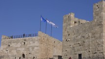 Footage of flags flying on the walls of Jerusalem