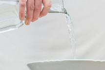pouring water in a bowl 