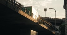 New York City cars driving on bridge in golden hour