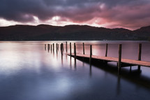 A view across Derwent water lake at dawn, with Jetty in foreground.
Lake District.
Cumbria.
England.
