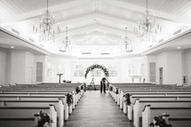 Church pews decorated for a wedding 