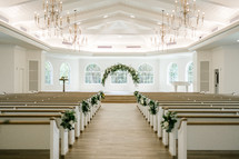 Church pews decorated for a Wedding 