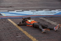 marathon runner on the ground 