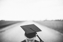 Graduate in the middle of the road.