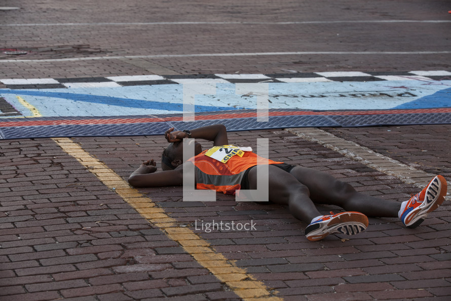 marathon runner on the ground 