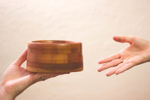 passing an offering bowl 