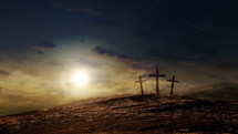 Three crosses on a hill at dusk with moving clouds background. Easter and Good Friday concept. Seamless looping