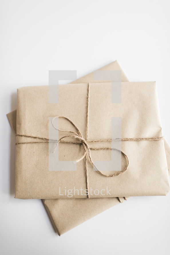 simple gifts wrapped in brown paper 