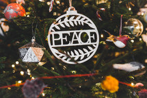 peace ornament on a Christmas tree 