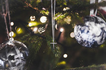 cross necklace in a Christmas tree 