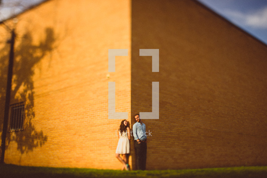 Couple standing in front of building 