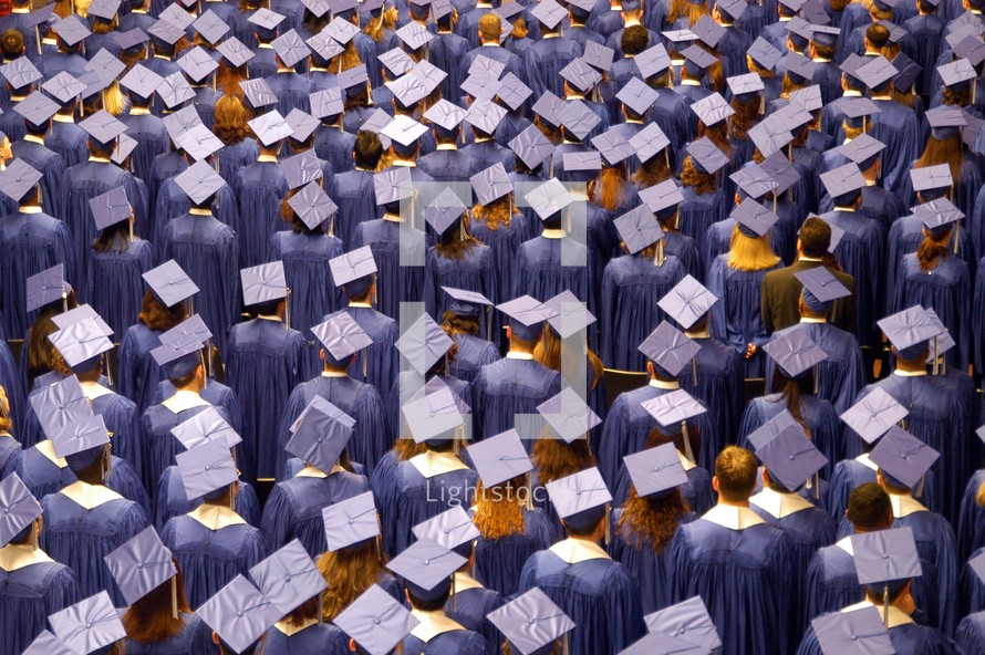 A crowd of graduates in cap and gown