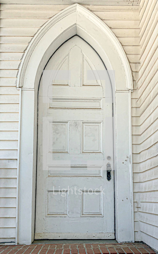 gothic door on a white church 