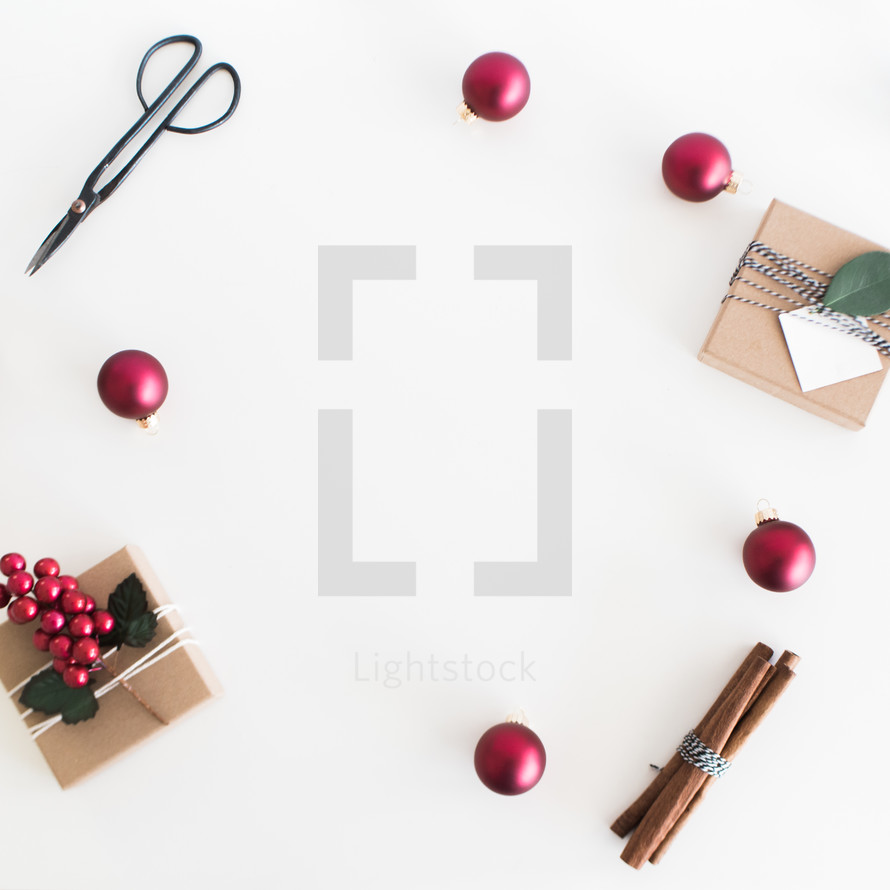 border of ornaments cinnamon sticks, scissors, and gift boxes 
