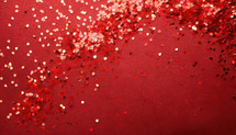 Red Confetti on Red Background