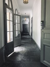 long hallway with stone floor 