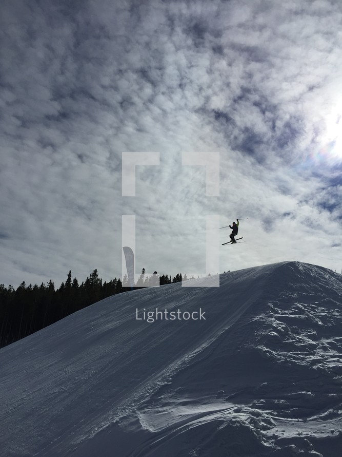 skier jumping on a slope 