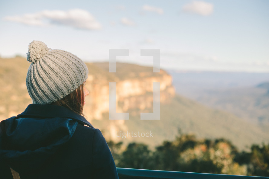 Woman looking out over a canyon.