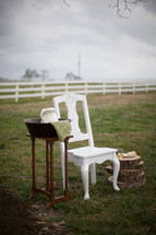 washing basin and a white chair for feet washing ceremony at a wedding 