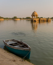 boat tied to a shore on a river in Jaisalmer 