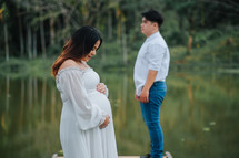 portrait of an expecting couple outdoors 