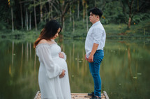 portrait of an expecting couple outdoors  