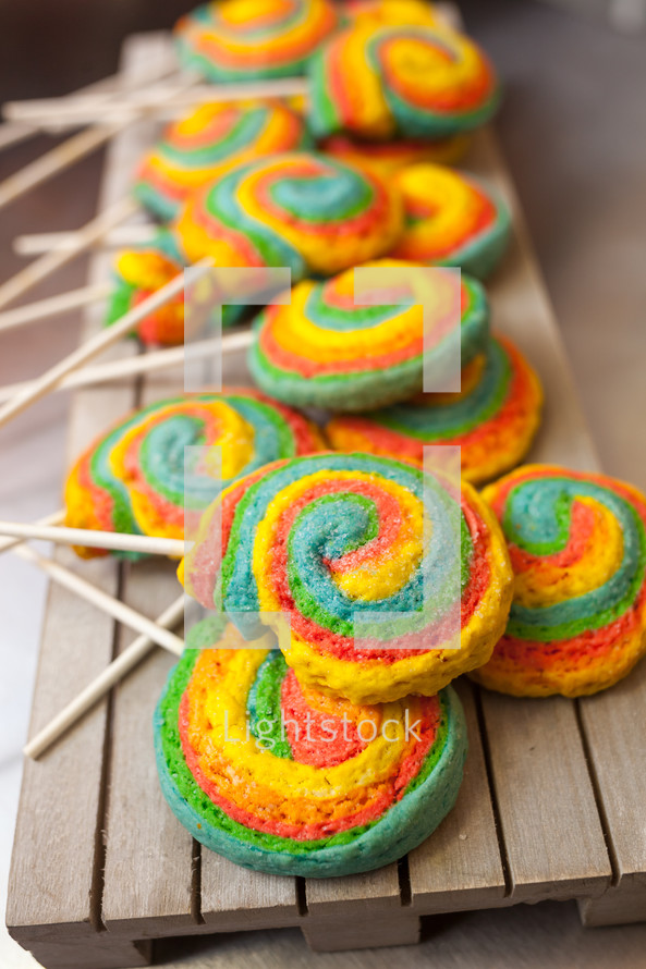 Pinwheels Lollypop for Carnival. Colored shortbread cakes