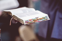 Bible holding Bibles during a worship service 