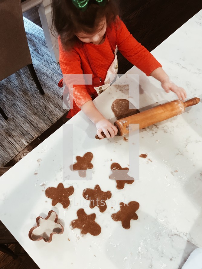 a child making Christmas cookies 