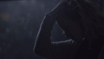 silhouette of a woman's face in darkness 