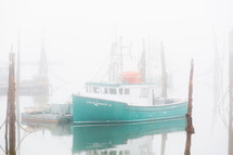 boat in a foggy harbor 