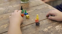Child playing with dice and counters