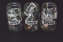 give, save, spend mason jars with money 