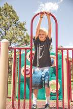 boy child playing on a playground 