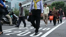 crossing a busy street using a crosswalk in Taiwan 