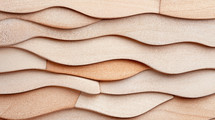 Elegant, flowing plywood layers in a seamless wave pattern, showcasing soft curves and natural wood texture, ideal for modern design and backgrounds.