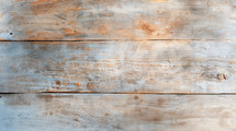 Weathered plywood texture with soft, muted tones of brown and blue, displaying natural wood grain and imperfections, ideal for backgrounds or design.