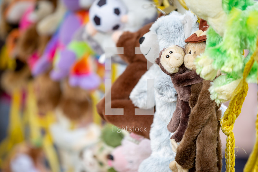 Stuffed animals hanging on display