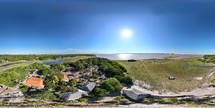 360 aerial photo taken with drone of restaurant next to river in Ponta Verde  in Lençóis Maranhenses National Park in northeast Brazil.