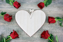 white wood heart and red roses 
