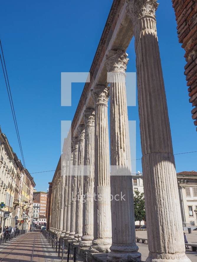 MILAN, ITALY - MARCH 28, 2015: Colonne di San Lorenzo meaning St Lawrence columns, ancient Roman ruins Milan Italy
