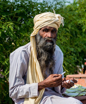 a man smoking a cigarette in India 
