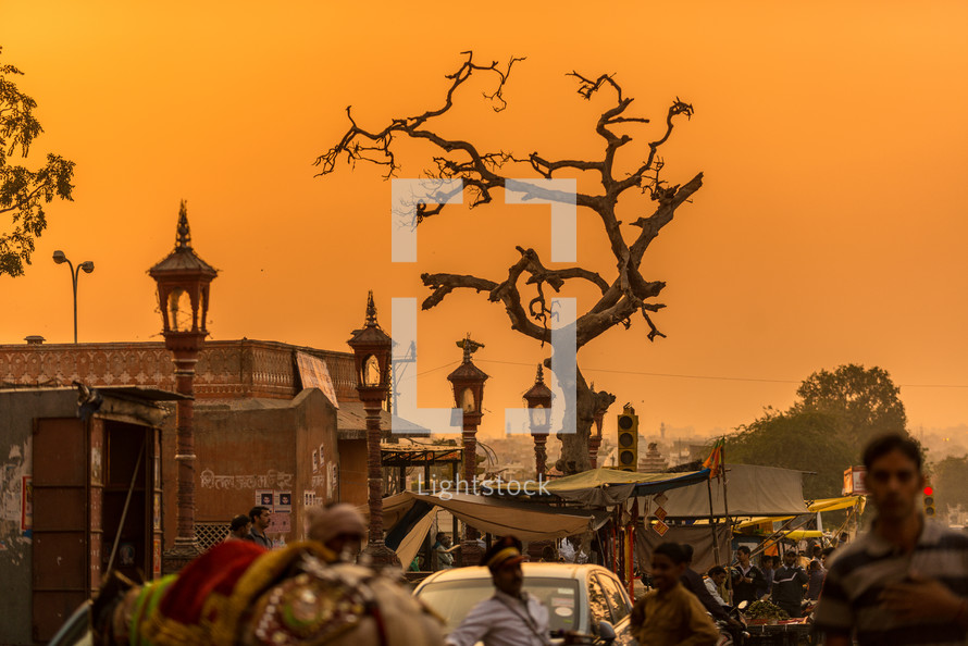 crowded village in India at sunset 