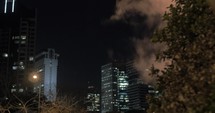 Tel Aviv night cityscape with condensing steam