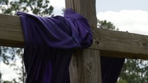 purple cloth on a cross