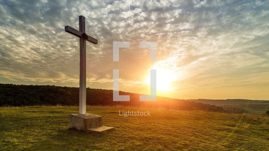 Cross on the hill at sunset
