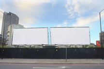 Two blank billboards side by side